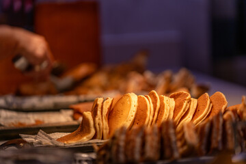Line of pancakes in the counter of a buffet restaurant
