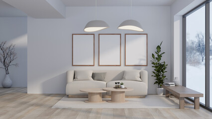 Interior design of a modern spacious living room with a couch and frames mockup on the white wall.