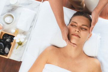 Panorama top view of woman enjoying relaxing anti-stress head massage and pampering facial beauty skin recreation leisure in dayspa modern light ambient at luxury resort or hotel spa salon. Quiescent - obrazy, fototapety, plakaty