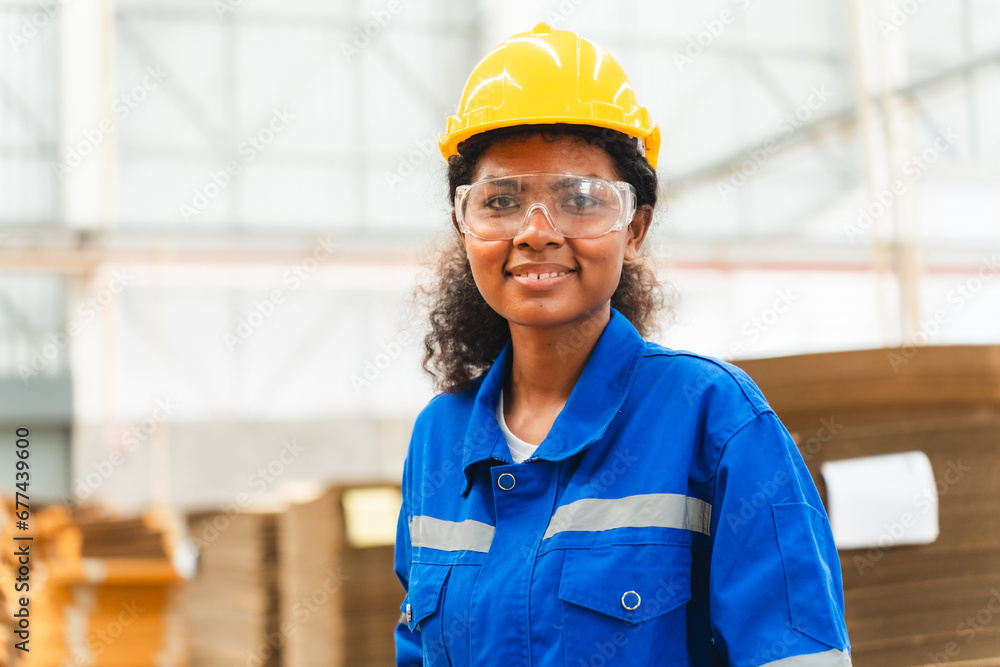 Wall mural portrait female professional engineer factory in protective uniform operating machine, engineering w