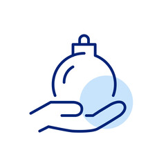 Christmas ball in hand. Winter holidays celebration. Pixel perfect, editable stroke icon