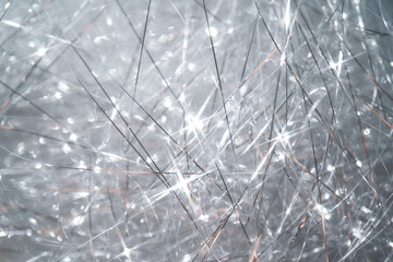 Abstract Christmas background made of tinsel with bokeh.