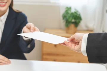 Deurstickers Good job Asian manager businesswoman giving financial reward in an envelope, business letter extra salary to company employee, woman worker office hand received premium bonus, getting cheque from boss © KMPZZZ