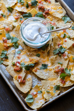 Nachos on a Sheet Pan with Sour Cream