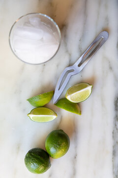 bartender cutting limes on a table
