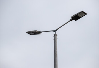 metal pipe, antenna, lamp, against the sky