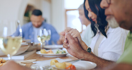 Home, praying and family with food, lunch and festive celebration with blessing, brunch and thanksgiving. Holding hands, apartment and group of people with religion, ritual and gratitude with worship - obrazy, fototapety, plakaty
