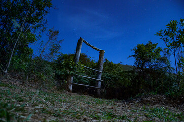 Wooden portal with a starry sky as a background