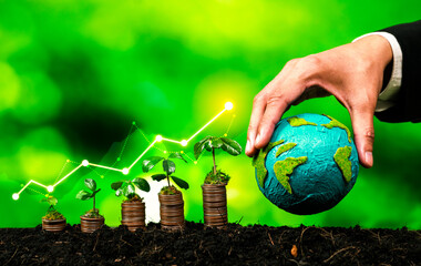 Growing coin or money stack with ESG businessman hold Earth globe symbolize eco investment with...