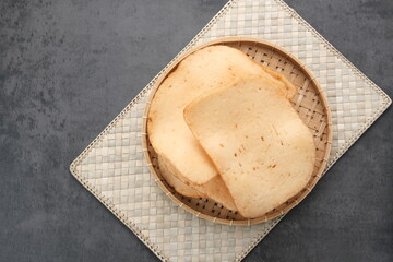 Kerupuk Udang, Crispy Prawn Crackers in bamboo plate. 
