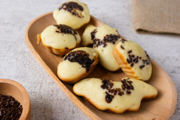 Kue cubit, a side snack from Jakarta, Indonesia. This cake got its name because the ripe cake was picked up with tongs by the seller, so it looked like it was being pinched.