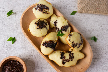 Kue cubit, a side snack from Jakarta, Indonesia. This cake got its name because the ripe cake was...