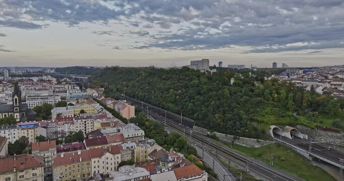 Prague Czechia Aerial v85 cinematic low level drone flyover Karlin neighborhood across Vitkov Hill memorial park, reveals Zizkov cityscape views - Shot with Mavic 3 Cine - November 2022