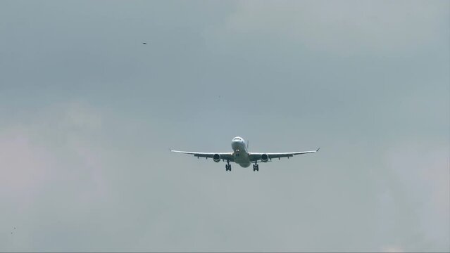 A passenger aircraft is preparing to land at Don Muang Airport in Bangkok, Thailand.