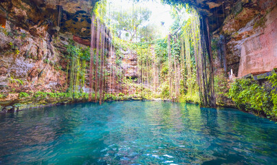 Ik-Kil Cenote - Lovely cenote in Yucatan Peninsulla with transparent waters and hanging roots....
