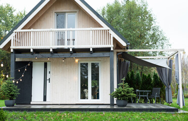 Tiny modern wooden house with a terrace