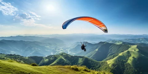 Tuinposter Man flying a paraglider over green pastures in a mountainous area © vectorizer88
