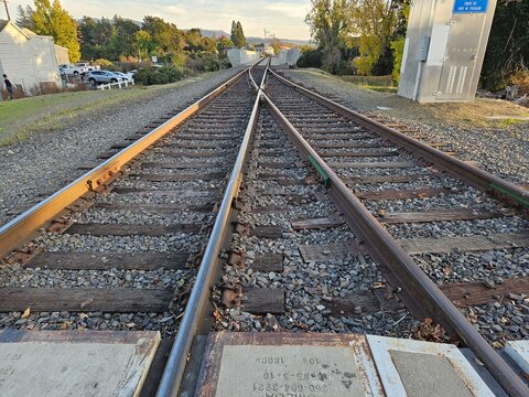 Line formation by train tracks in an intersection where the track will switch to another route in Napa California