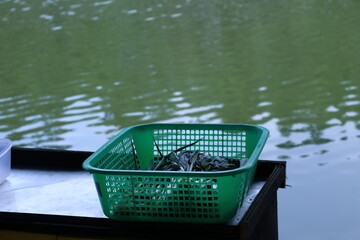 Close-up of green basket on table