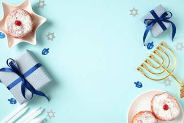 Hanukkah Greeting Card Template. Celebrate the season with this vibrant flat lay, showcasing a menorah, candles, sufganiyots, and gift boxes on rich blue backdrop