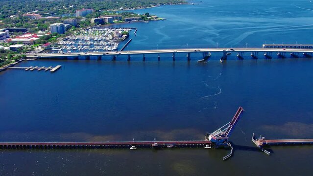 Manatee River Bridge And CSX Train Bridge Across Manatee River In Bradenton, Florida. aerial sideways