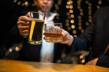 Barman pouring whiskey whiskey glass..