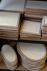 Wooden macrame base for kids bed or swing, crochet hooks top view in handicraft store, craft supplies on a shelf in handmade shop