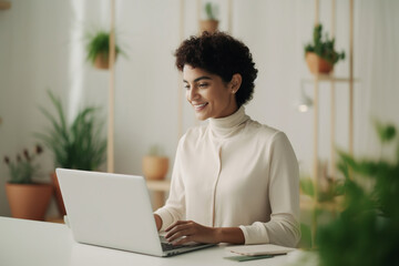 Cheerful Business Woman Working from Home on Laptop Computer