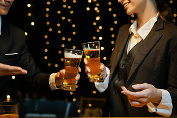 food and drink male friends are happy drinking beer and clinking glasses at a bar or pub.