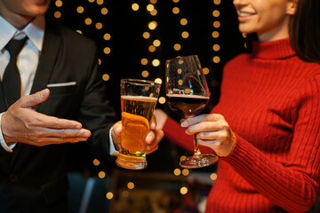 food and drink male friends are happy drinking beer and clinking glasses at a bar or pub.