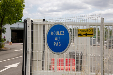 Drive slowly sign in France called means roulez au pas in french text language