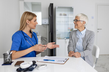 Young female professional doctor physician consulting patient, talking to senior woman client at medical checkup visit. diseases treatment. medical health care concept