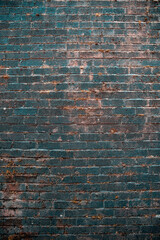 An old wall made of bricks dramatic dark background