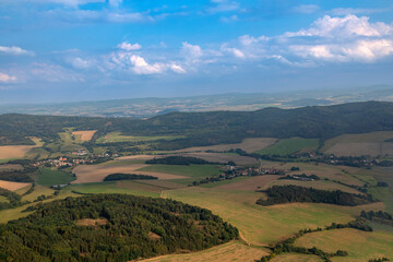 View on spring landscape with villages in a valley in Czech Republic.