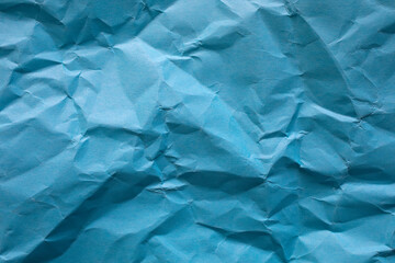Crumpled blue paper as background. - 677515691