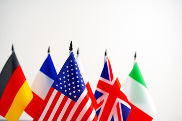 Lots of small national flags on table