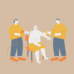 Fototapeta premium An elderly man being washed by two care staff.