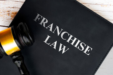 Top view of Franchise Law book with gavel background. Law concept