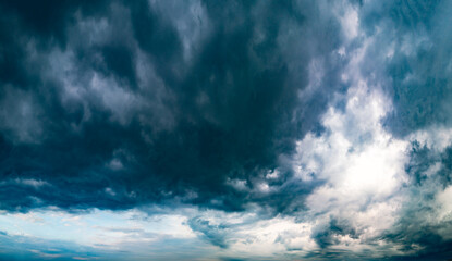 Naklejka na ściany i meble Dramatic storm clouds over panoramic scenic horizon.