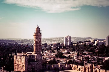 Fotobehang Tower of David and ancient citadel under blue sky as Mamilla neighborhood on background in Jerusalem, Israel. © diy13