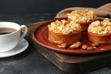 Tart pie with almond petals on plate