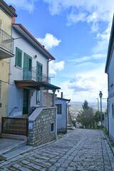 A narrow street among the old houses of Frigento, a town in Campania in Italy.
