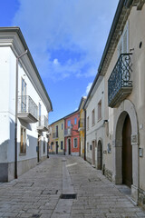A narrow street among the old houses of Frigento, a town in Campania in Italy.