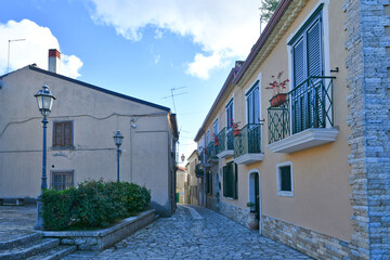 A narrow street among the old houses of Frigento, a town in Campania in Italy.