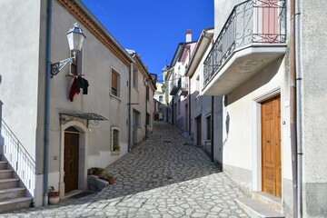 A narrow street among the old houses of Frigento, a town in Campania in Italy.