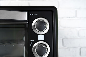 Close up of black mini electric oven home appliance