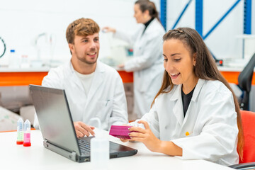 Scientist using laptop during scholarship in the university laboratory