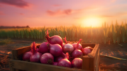 Red onions harvested in a wooden box with field and sunset in the background. Natural organic fruit abundance. Agriculture, healthy and natural food concept. Horizontal composition. - obrazy, fototapety, plakaty