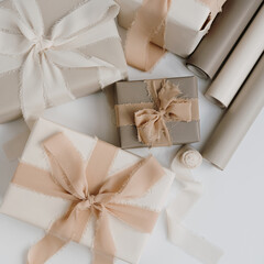 Gift boxes packaging on white background. Festive Christmas, New Year holidays celebration concept. Flat lay, top view