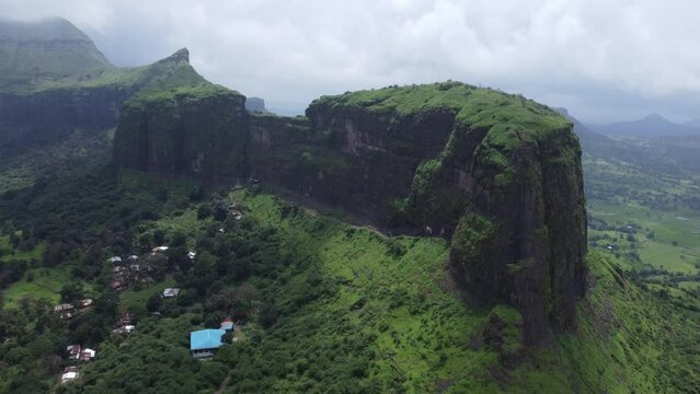 Aerial view of the scenic landscape of Sahyadri mountain range during monsoon, Brahmagiri mountain range in the background, Trimbakeshwar, Nashik, India